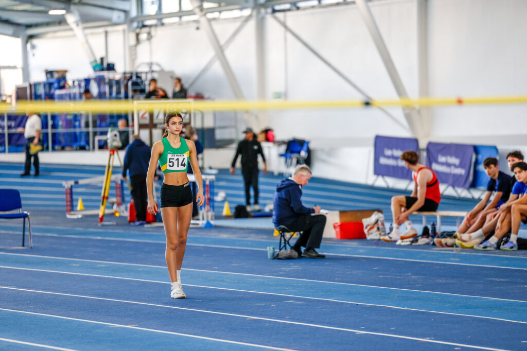 Focused and poised, Leila Newth stands ready to take on the high jump